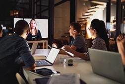 Staff in video conference via TV monitor